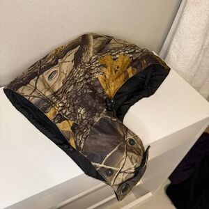 Insulated camo hat with hood, adjustable straps, and snap-on ear flaps